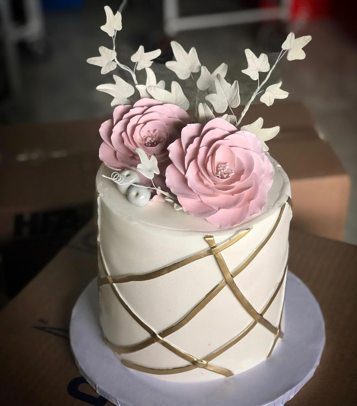 Vanilla cake decorated with edible flowers and designs